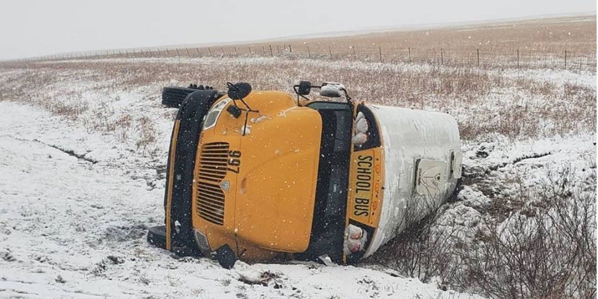 17 children hospitalized after school bus flips on snowy Kansas Turnpike 