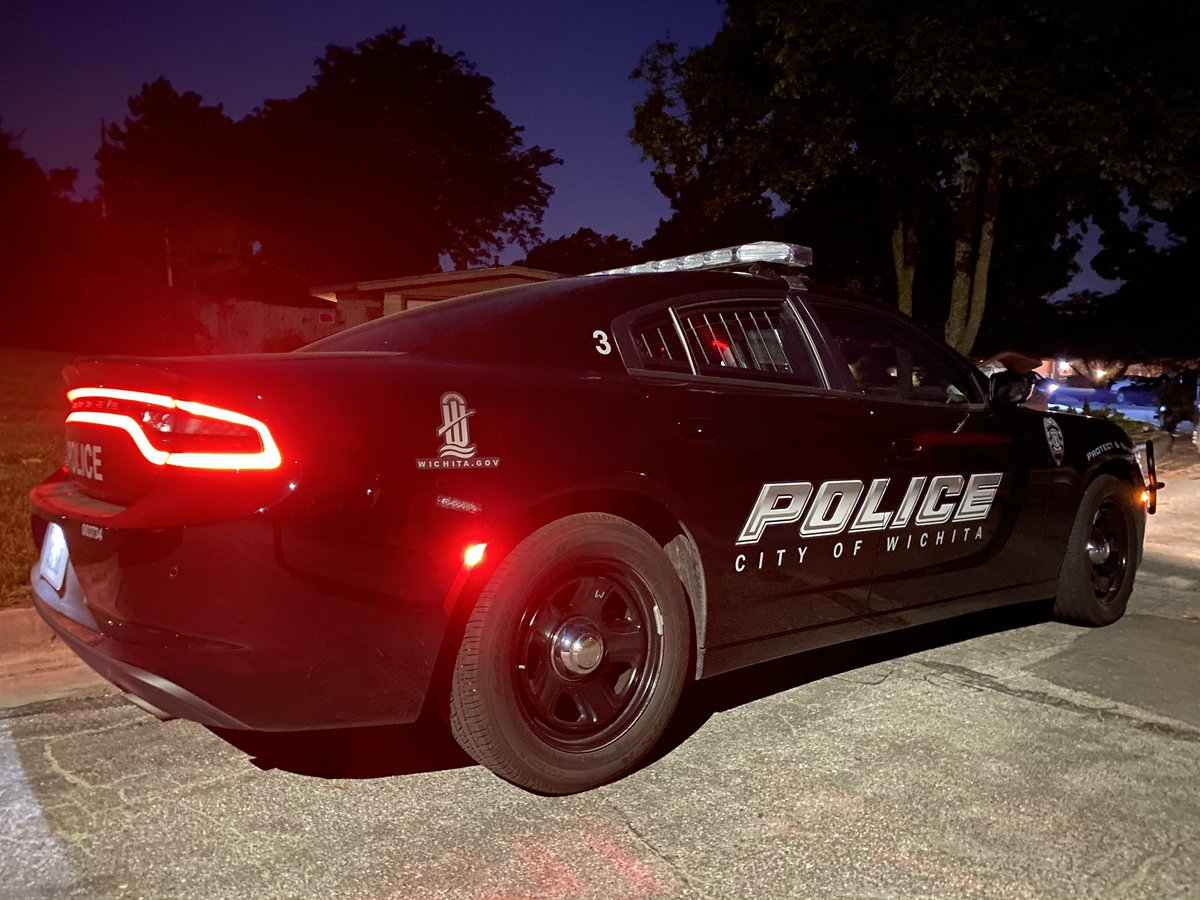 Police have put crime scene tape & set up a partition in front of the home where the shooting took place.   man is killed in a shooting near Parkwood & 13th, between Woodlawn & Oliver in Wichita.