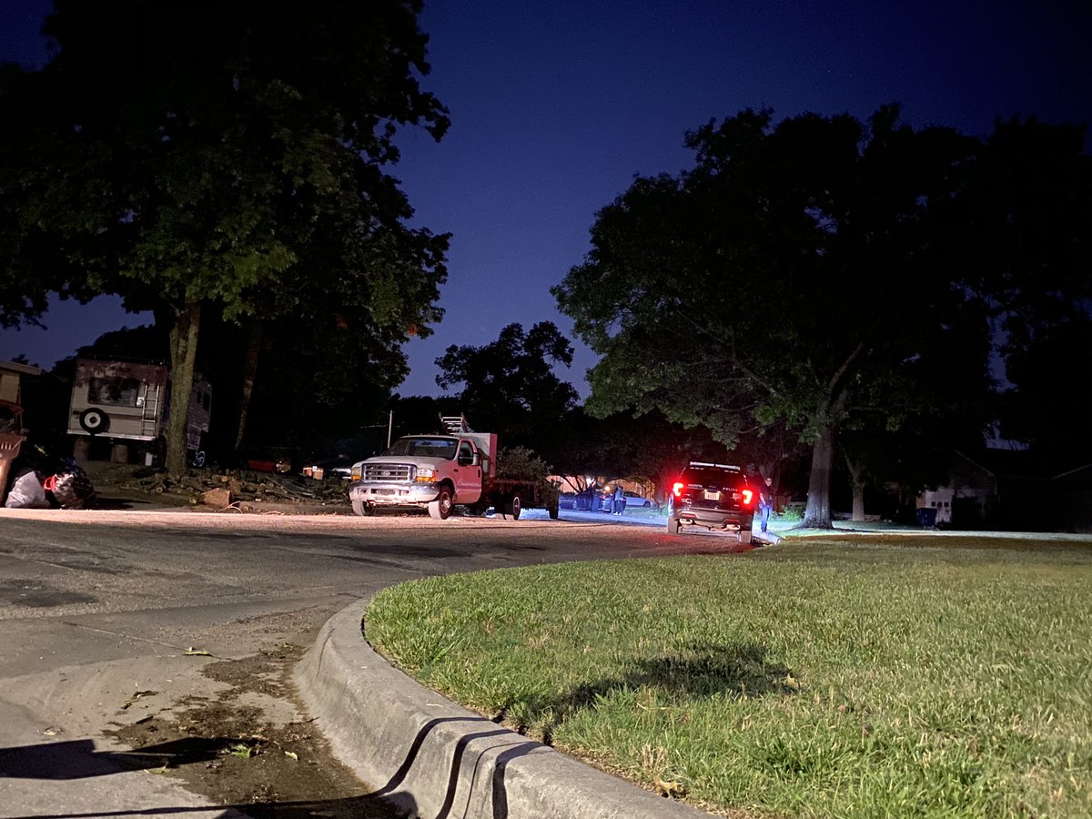 Police have put crime scene tape & set up a partition in front of the home where the shooting took place.   man is killed in a shooting near Parkwood & 13th, between Woodlawn & Oliver in Wichita.