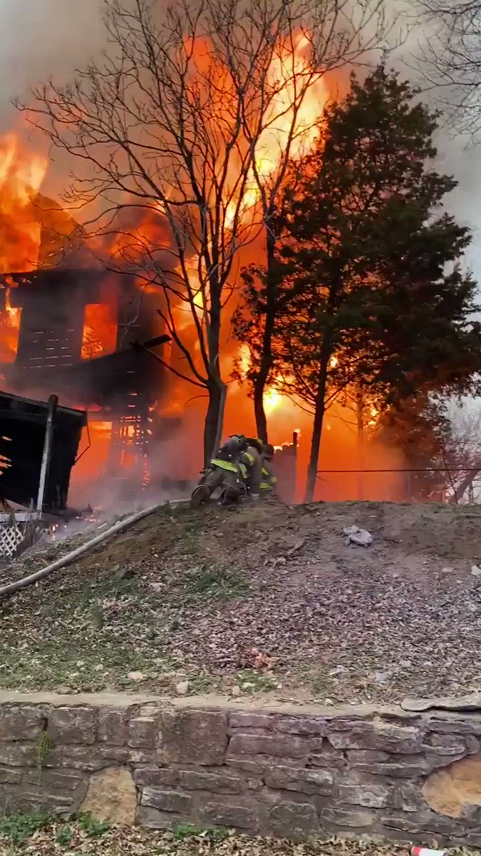 Fire crews battling residential structure fire. Upgraded to 2nd Alarm because of exposure to adjacent structure